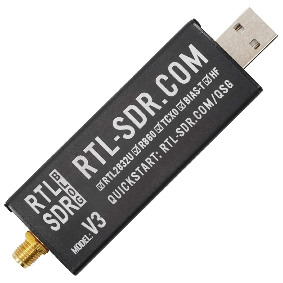 An RTL-SDR Blog dongle, a black aluminium USB stick with an SMA antenna connector at one end